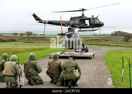 The only Vietnam War combat veteran helicopters in Britain – complete with patched up bullet holes – displaying at their base near Wesham, Lancashire Stock Photo