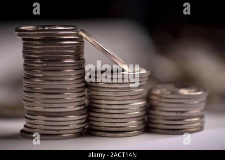 Financial and business chart and graphs, Qatari money coin and banknotes Stock Photo