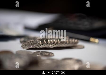 Financial and business chart and graphs, Qatari money coin and banknotes Stock Photo