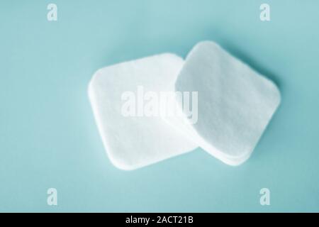Cosmetology, cleanliness and branding concept - Organic cotton pads on mint background, cosmetics and make-up remover, hygiene and skincare beauty bra Stock Photo