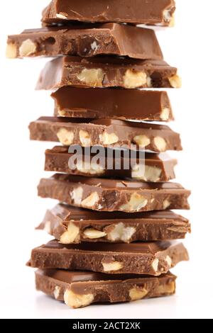 Tasty morsel of milk chocolate with nuts. Stock Photo