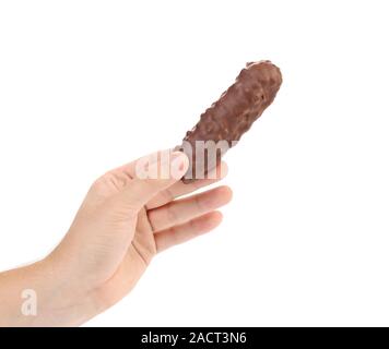 Hand holds bar chocolate. Stock Photo