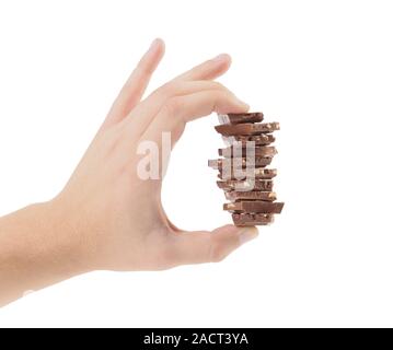 Hand holds milk chocolate with nuts. Stock Photo