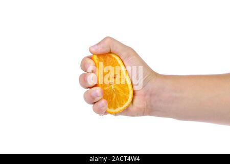 Hand squeezing an orange Stock Photo