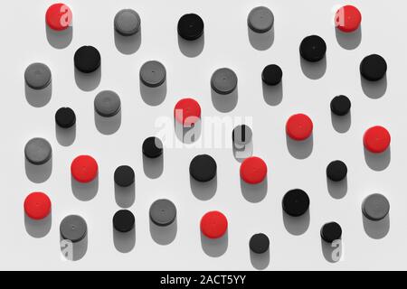 Plastic bottle caps background with black and red color random pattern on white background Stock Photo