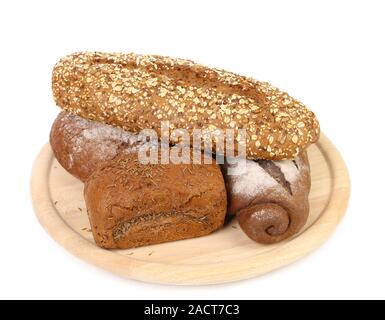 shot of assorted bread in a wooden tray Stock Photo