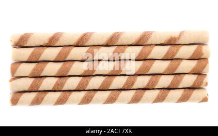 Wall of waffle rolls with chocolate cream. Stock Photo