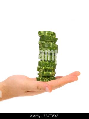 Hand holds stack juicy cucumber Stock Photo