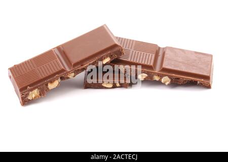 Tasty morsel of milk chocolate with nuts. Stock Photo