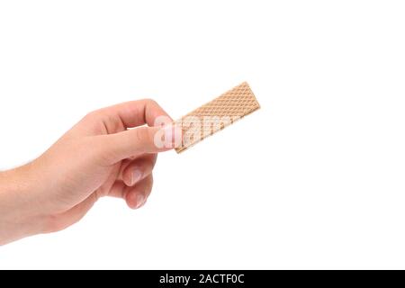 Hand holds wafer of chocolate. Stock Photo