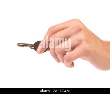 Hand holds a  small key Stock Photo