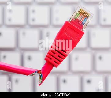 Defective network cable on keyboard Stock Photo