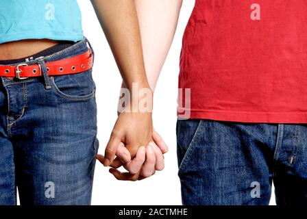 Relationship. Close-up of a man and woman holding hands. Stock Photo