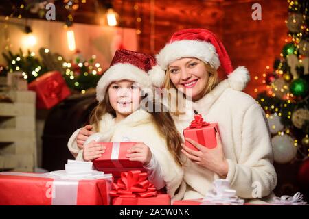 https://l450v.alamy.com/450v/2acw0nk/merry-christmas-mother-and-daughter-love-holidays-xmas-gift-boxes-open-present-small-child-girl-with-mom-in-santa-hat-winter-shopping-sales-happy-family-celebrate-new-year-2acw0nk.jpg