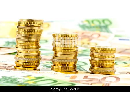 Stack of money coins, sinking curve Stock Photo