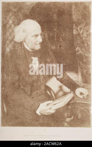Revd. Dr John Brown. Three-quarter length seated portrait of the Rev. Dr John Brown (1784-1858), seated at a table, looking off to the right, with a b Stock Photo