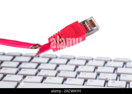 Defective network cable on keyboard Stock Photo