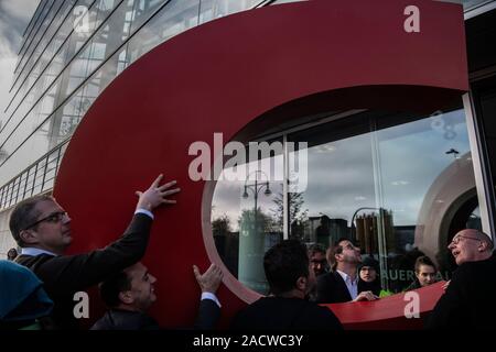 Berlin, Germany. 03rd Dec, 2019. Employees of the CDU federal party headquarters carry the 'C' into the federal party headquarters, which activists of the environmental protection organization Greenpeace stole from the federal party headquarters days ago and have now brought back. Credit: Paul Zinken/dpa/Alamy Live News Stock Photo
