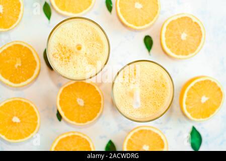 halves of oranges sliced for making orange juice Stock Photo