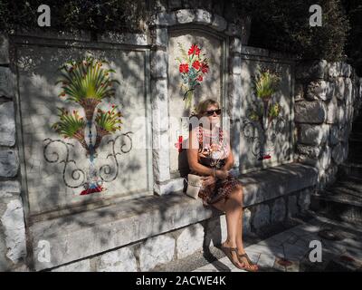 Middle aged woman enjoying the sunshine Stock Photo