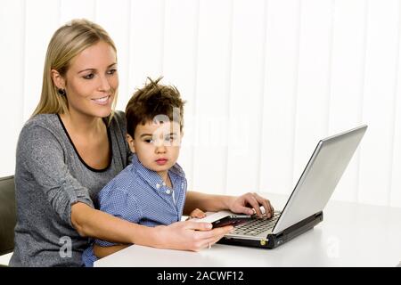 Mother and son at the computer Stock Photo