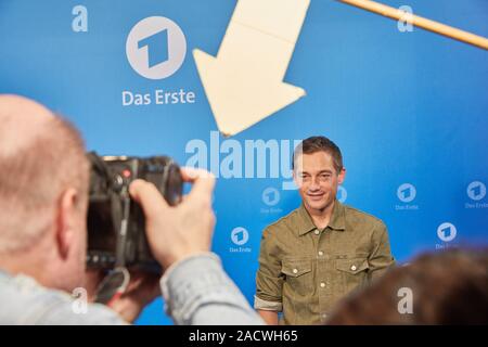 Hamburg, Germany. 03rd Dec, 2019. Volker Bruch, actor, stands in front of a logo wall at a photo shoot on the occasion of the ARD annual press conference. Credit: Georg Wendt/dpa/Alamy Live News Stock Photo