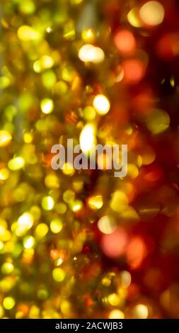 abstract background natural festive red gold bokeh sequins tinsel Stock Photo