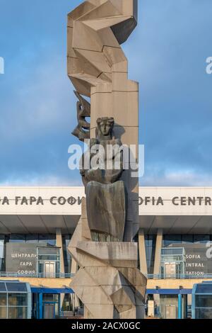 Sofia Central Station with Soviet era sculpture in the centre of a circular plaza. Opened in 1974 the station was designed by architect Milko Bechev. Stock Photo