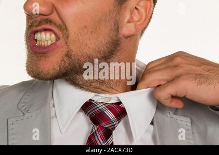 Man bursts his collar Stock Photo