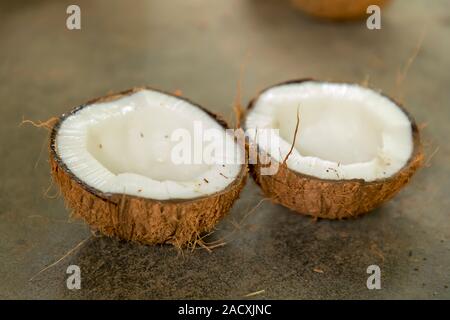 two parts on cracked coconut isolated on ground Stock Photo