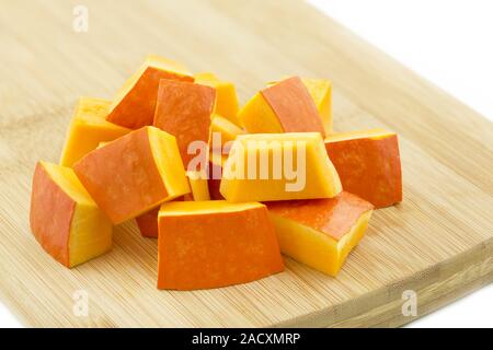 Pieces of Hokaido pumpkin on wooden boards Stock Photo