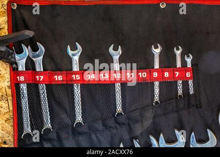 Set mechanical tools. Professional car mechanic using different tools for working in auto repair service. Silver spanners. Stock Photo