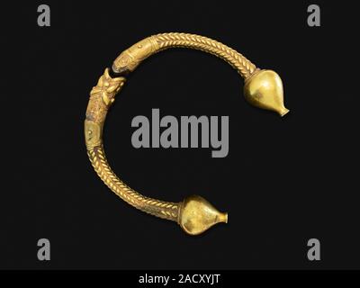 Antique golden bracelet called torc isoled on black background. Rigid neck ring or bracelet from Celts. Circa 1st to 2nd century BC. Galicia, Spain