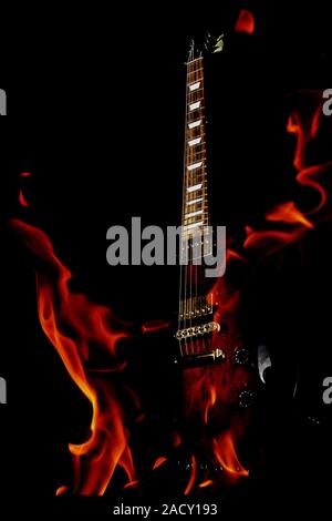 double exposure  electric guitar and fire Stock Photo