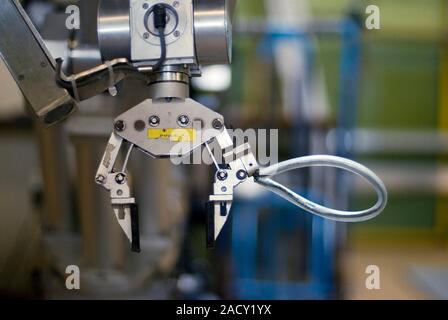 Emergency response robot. Close-up of the pincer 'hand' on the EROS robot used by Groupe INTRA, a French emergency response organisation. This robot i Stock Photo