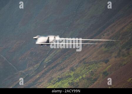 F-15 Eagle, USAF Mc Donnell Douglas low-level fighter jet flying from Valley Anglesey through the Mach Loop in Cadair Idris Wales