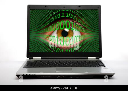 Cyberspying. Conceptual image of a human eye and binary code on a laptop computer screen, representing the use of computer technology and networks to Stock Photo