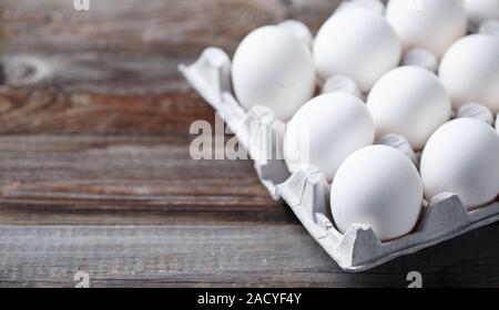 White eggs on a rustic wooden table Stock Photo