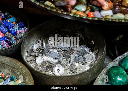 Jewels, gems, coins and old keys on Jerusalem flea market Stock Photo
