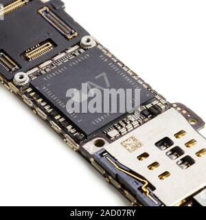 Apple A7 microchip. This microchip was used in the iPhone 5S (September 2013). It acts as the central processing unit (CPU) for a smartphone or tablet Stock Photo