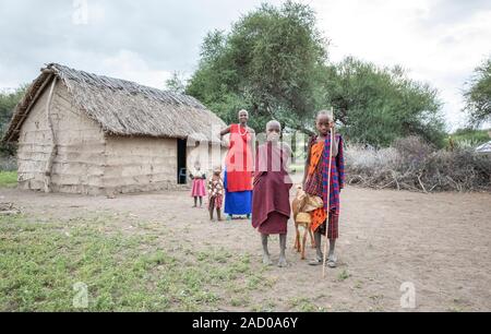 Same, Tanzania, 7th June 2019: maasai kid with a goat Stock Photo