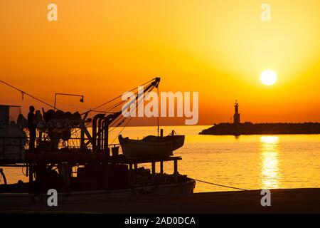 A fishing boat in Myrina, on the isle of Lemnos, Greece at sunset. Stock Photo