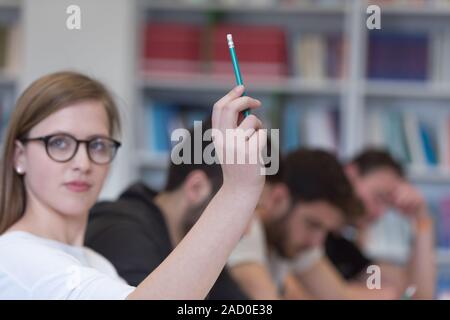group of students  raise hands up Stock Photo