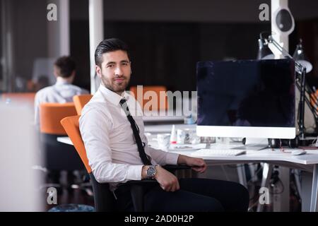 young Business man  working on desktop computer Stock Photo