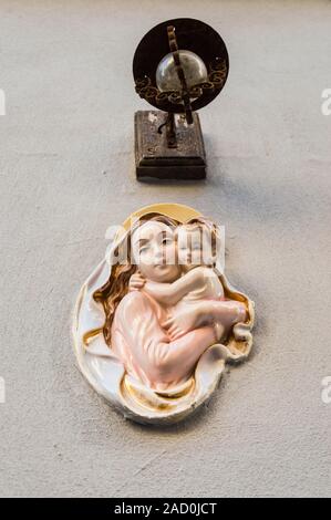 Religious icon. On stone wall of Virgin Mary and the holy child Jesus Stock Photo