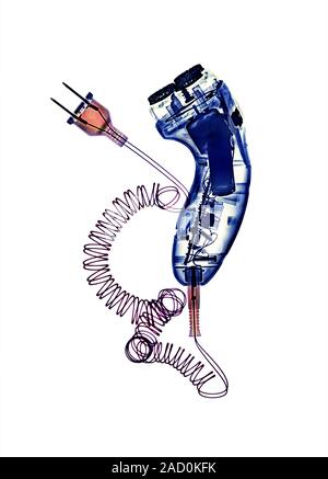 Electric shaver, coloured X-ray. Stock Photo