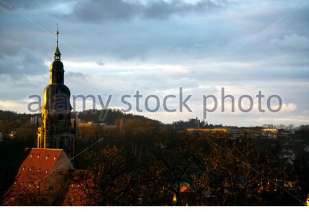 A view of the Morzitz church tower in Coburg Germany as the sun goes down Stock Photo