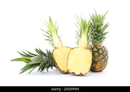 Pineapples and two halves isolated on white background. Juicy fruit Stock Photo