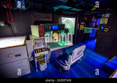 San Diego, Navy Pier, California, USA - JULY 31, 2018: operations room with lights on instruments, consoles, maps and radars of Battleship Midway at Stock Photo