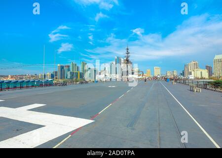 San Diego, Navy Pier, California, USA - August 1, 2018: Big flight deck runway of USS Midway warship at San Diego pier. Served in World War II and Stock Photo